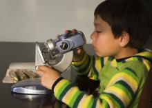 boy with microscope